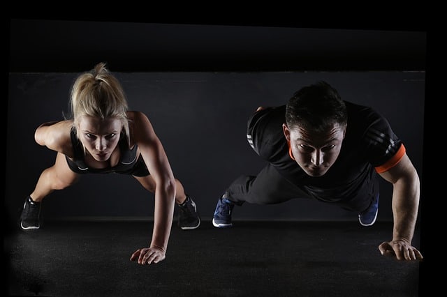 fit couple doing pushups