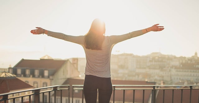 girl on balcony in sun