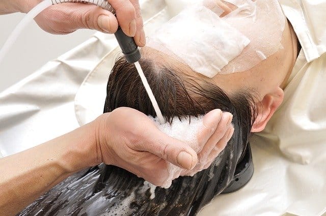 applying shampoo to scalp