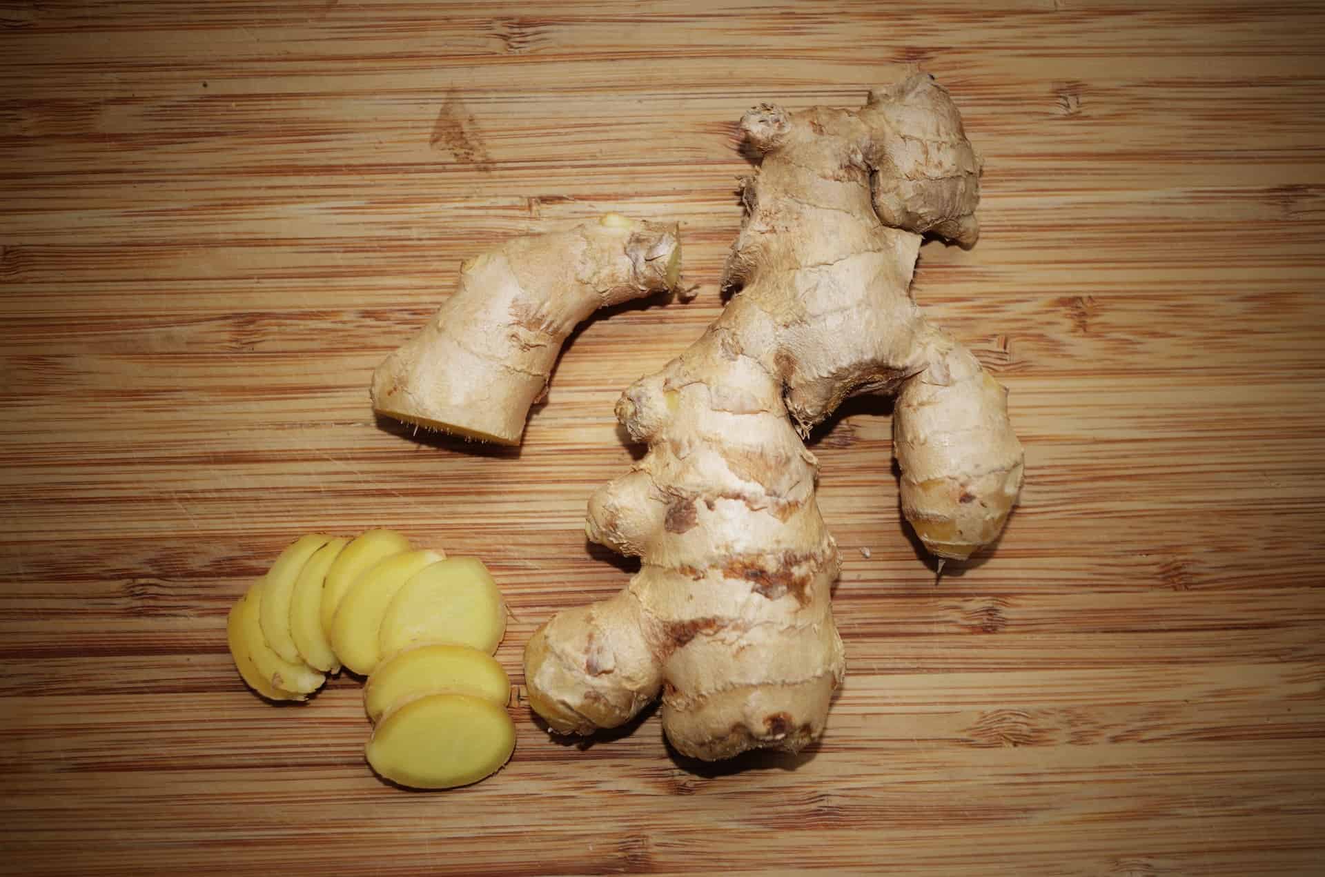 sliced up ginger on cutting board