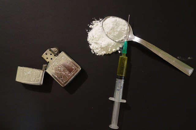 needles and drugs on table