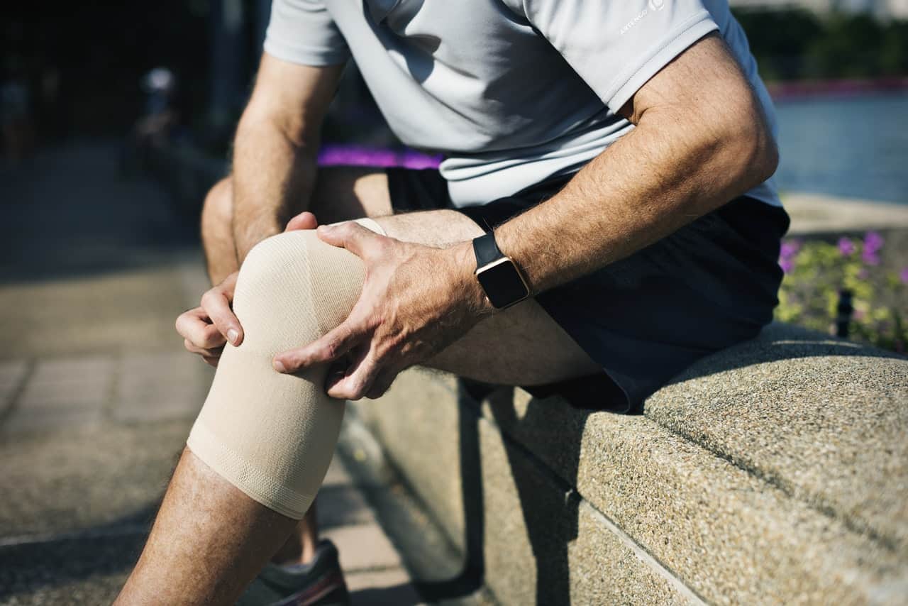 man with injured knee